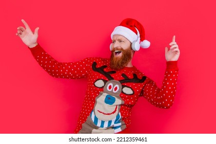 Glad Bearded Man Celebrate Christmas With Music. Man In Headphones Listen Christmas Music