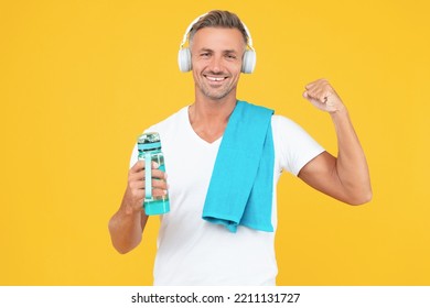 Glad Guy Holding Bottle To Keep Sport Lifestyle. Guy With Towel And Bottle After Training.