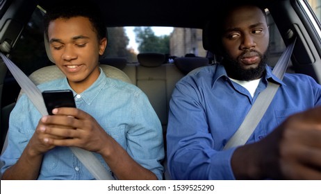 Glad Teenager Chatting Phone In Car, Dad Trying To Read Messages, Parent Control