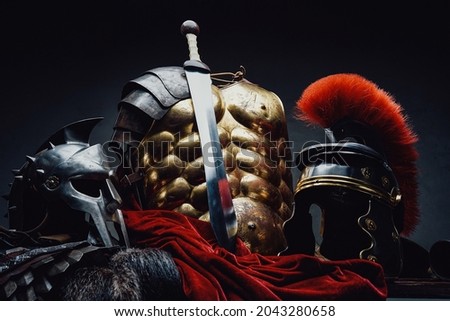 Gladius and bronze armor with two helmets