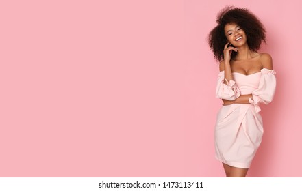 Glam model looking fabulous in pink mini dress.
