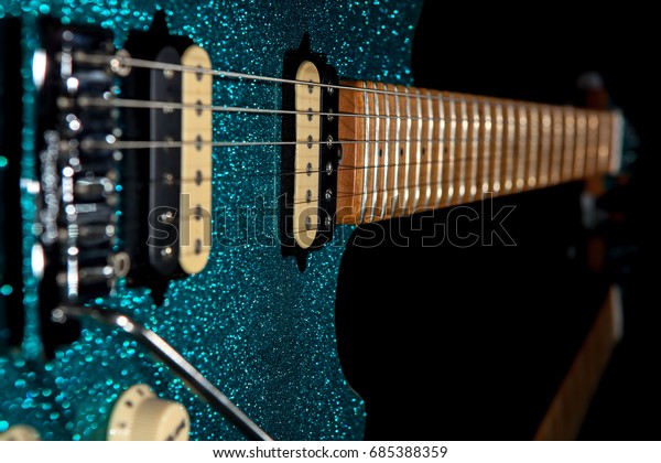 Glam rock
guitar. Stunning electric guitar with beautiful glitter finish.
Loud christmas party music
image.