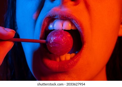 Glamor Mouth Licking Yummy Lollypop With Red Lips. Sucks Lolli Pop. Sexy Female Lip. Sensual Woman Red Lips With A Lollipop. Candy Bar Concept.