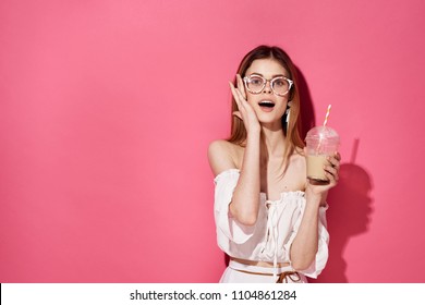  Glamor Woman In Glasses With A Drink Of Coffee On A Pink Background                              