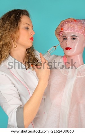 glamorous doctor makes plastic surgery on the face of a mannequin. turquoise background