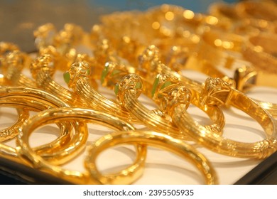 Glamorous golden bracelet selling in grand bazaar market. - Shutterstock ID 2395505935