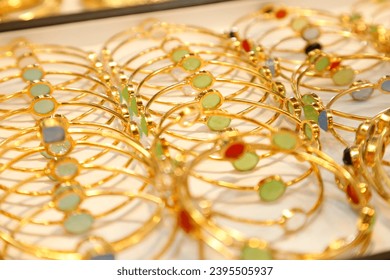 Glamorous golden bracelet selling in grand bazaar market. - Shutterstock ID 2395505937