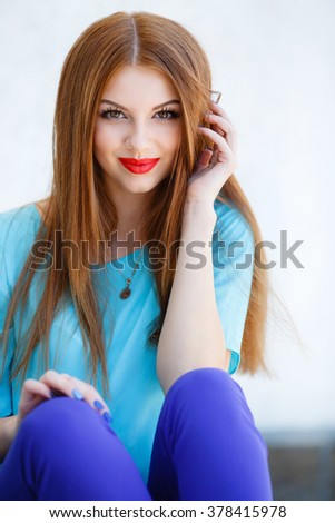 glamorous portrait of young beautiful woman in bright clothes. red lips. Summer portrait of a beautiful young Caucasian girl with red straight hair. fashion portrait. woman portrait