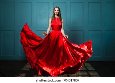 Glamorous Woman in Fashionable Red Dress. Beautiful Fashion Model, Full Portrait