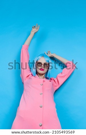 glamorous woman in sunglasses wears a blue wig makeup Lifestyle posing