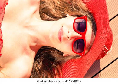 Glamorous Young Woman Sun Tanning At Pool Deck  - Beautiful Girl Sunbathing Close-up Of Face View From Above  - Concept Of Beauty And Skin Care To Prevent Sunburn During Summer Holiday