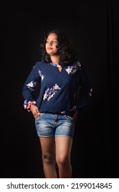 Glamour Confident South Asian Teen Girl Women Studio Photography Pose With Blue Short And Blouse With Nice Hair Layer Cut. 