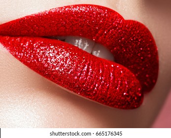 Glamour fashion bright pink lips gloss make-up with gold glitter. Macro of woman's face part. Sexy glossy lip makeup, luxury lady