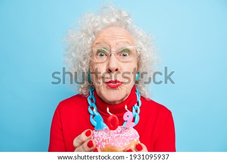 Similar – Image, Stock Photo round red glazed donut and paper cup with coffee