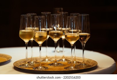 Glamour Party. A Lot Of Champagne Prosecco Glasses On A Golden Plate To Welcome The Guests Of A Party.