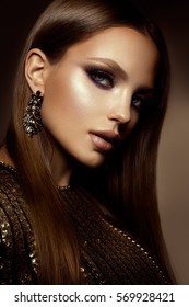 Glamour Portrait Of Beautiful Girl Model With Makeup And Romantic Hairstyle. Fashion Shiny Highlighter On Skin, Sexy Gloss Lips Make-up And Dark Eyebrows.