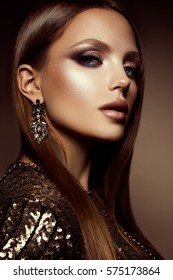 Glamour Portrait Of Beautiful Girl Model With Makeup And Romantic Hairstyle. Fashion Shiny Highlighter On Skin, Sexy Gloss Lips Make-up And Dark Eyebrows.