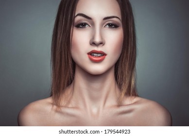 Glamour Portrait Of Sarcasm Beautiful Attractive Brunette Woman. Bright Fashion Makeup Red Lips Shiny Highlighter On Skin.