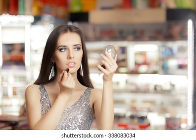 Glamour Woman with Lipstick and Make-up mirror - Cool girl holding a mirror and getting ready for a party
 - Powered by Shutterstock