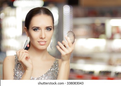 Glamour Woman with Lipstick and Make-up mirror - Cool girl holding a mirror and getting ready for a party
 - Powered by Shutterstock