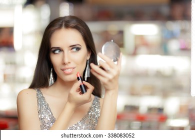 Glamour Woman with Lipstick and Make-up mirror - Cool girl holding a mirror and getting ready for a party
 - Powered by Shutterstock