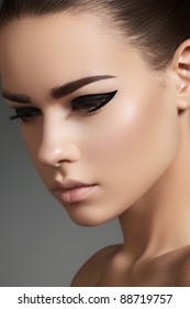 Glamourous Closeup Female Portrait. Fashion Evening Elegance Eyeliner Makeup On Model Eyes. Cosmetics And Make-up