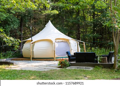 A glamping tent surrounded by forest in Ontario, Canada.