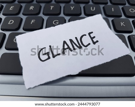Glance writting on laptop keyboard background.