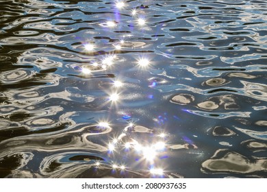 The Glare Of The Sun On The Water Surface, On The River. Nature. Close-up