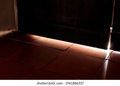 Glaring Light Through A Crack In The Door.