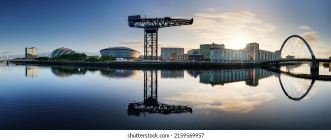 Glasgow Cityscape at sunrise, skyline panorama with reflecion in river with sun, Scotland - UK - Shutterstock ID 2159569957