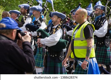 Glasgow, Scotland - 04 May 2019:  March For Independent Scotland, Bag Pipes Players In Kilt In Crowd