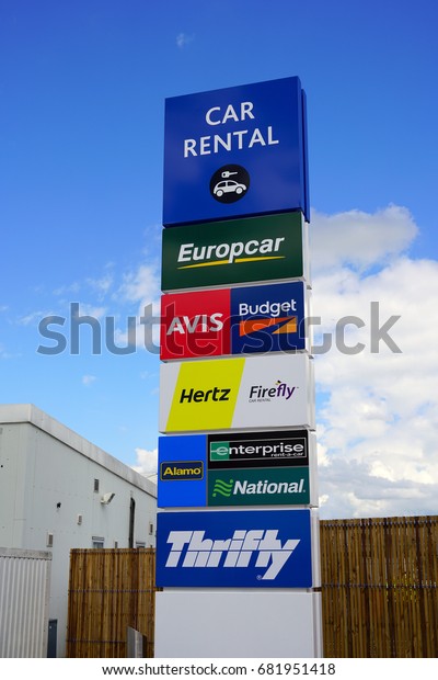 GLASGOW,\
SCOTLAND -11 JUL 2017- View of the car rental area with signs for\
car rental companies like Avis and Budget at the Glasgow Airport\
(GLA), the second busiest airport in\
Scotland.