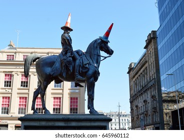 GLASGOW, SCOTLAND - 3 MAY 2017: Marochetti's Duke of Wellington statue stands outside Glasgow's Museum of Modern Art in Royal Exchange Square with locally added traffic cones.