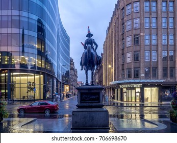 GLASGOW SCOTLAND - JULY 20: Equestrian Statue of Duke of Wellington wearing a traffic cone on his head on July 20, 2017 in Glasgow, Scotland. Behind - Gallery of Modern Art and Royal Exchange Square.