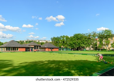 GLASGOW, SCOTLAND - JULY 21, 2016: People Playing Barefoot Bowls At The Kelvin Grove Bowling And Tennis Centre In Summer.