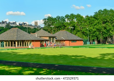 GLASGOW, SCOTLAND - JULY 21, 2016: Two Men Playing Barefoot Bowls At The Kelvin Grove Bowling And Tennis Centre In Summer.