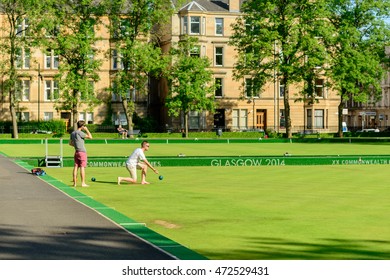 GLASGOW, SCOTLAND - JULY 21, 2016: Two Men Playing Barefoot Bowls At The Kelvin Grove Bowling And Tennis Centre In Summer.