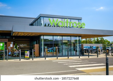 GLASGOW, SCOTLAND - MAY 16, 2019:  Main entrance to the Waitrose supermarket at Milngavie, Glasgow in summer.