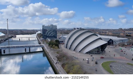 Glasgow, Scotland, UK; 2nd April 2022: Low level aerial image over the River Clyde including the Clyde Auditorium (Armadillo) and Crowne Plaza Hotel.