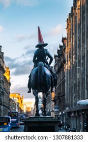 GLASGOW, SCOTLAND, UK - JANUARY 27. 2019: The Iconic Statue of the Equestrian statue of the Duke of Wellington wearing a traffic cone on his head outside the Gallery of Modern Art.