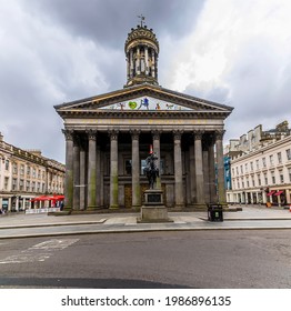 GLASGOW, UK - May , 2021: A view towards the Galley of Modern art and the statue of the Duke of Wellington  in Glasgow on a summers day