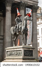 Glasgow, UK - September 4, 2019 - The iconic equestrian statue of Arthur Wellesley, 1st Duke of Wellington located outside the Gallery of Modern Art, Glasgow, Scotland