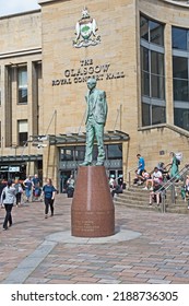 Glasgow, United Kingdom - August 9 2022: The Statue Of Donald Dewar, Scotland's First Ever First Minister, Stand At The Top Of Buchanan Street And In Front Of The Royal Concert Hall.