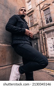 GLASGOW, UNITED KINGDOM - Dec 30, 2021: A Vertical Shot Of A Pakistani Male In An Urban Environment In Glasgow