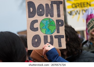 GLASGOW, UNITED KINGDOM – NOVEMBER 06, 2021: COP Protest Sign At Climate Protest March During COP26 In Glasgow, Scotland.