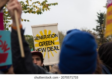 GLASGOW, UNITED KINGDOM – NOVEMBER 06, 2021: Green New Deal Protest Sign At Climate Protest March During COP26 In Glasgow, Scotland.