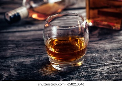 Glass With Alcohol Drink Whiskey On Bar Table