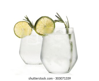 Glass with alcoholic drink with lime and ice isolated on white background. - Shutterstock ID 303071339