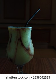 A Glass Of Avocado Juice With Dark Background